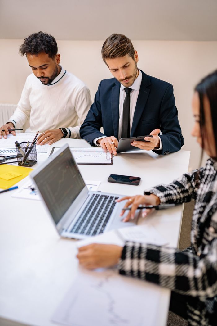 A diverse team of professionals working together in a modern office setting.